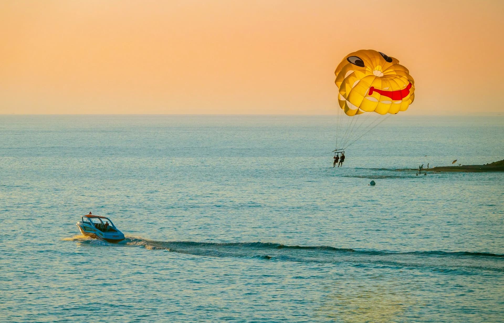 Parasail canopy rising behind a speedboat over turquoise water off Bavaro Beach in Punta Cana