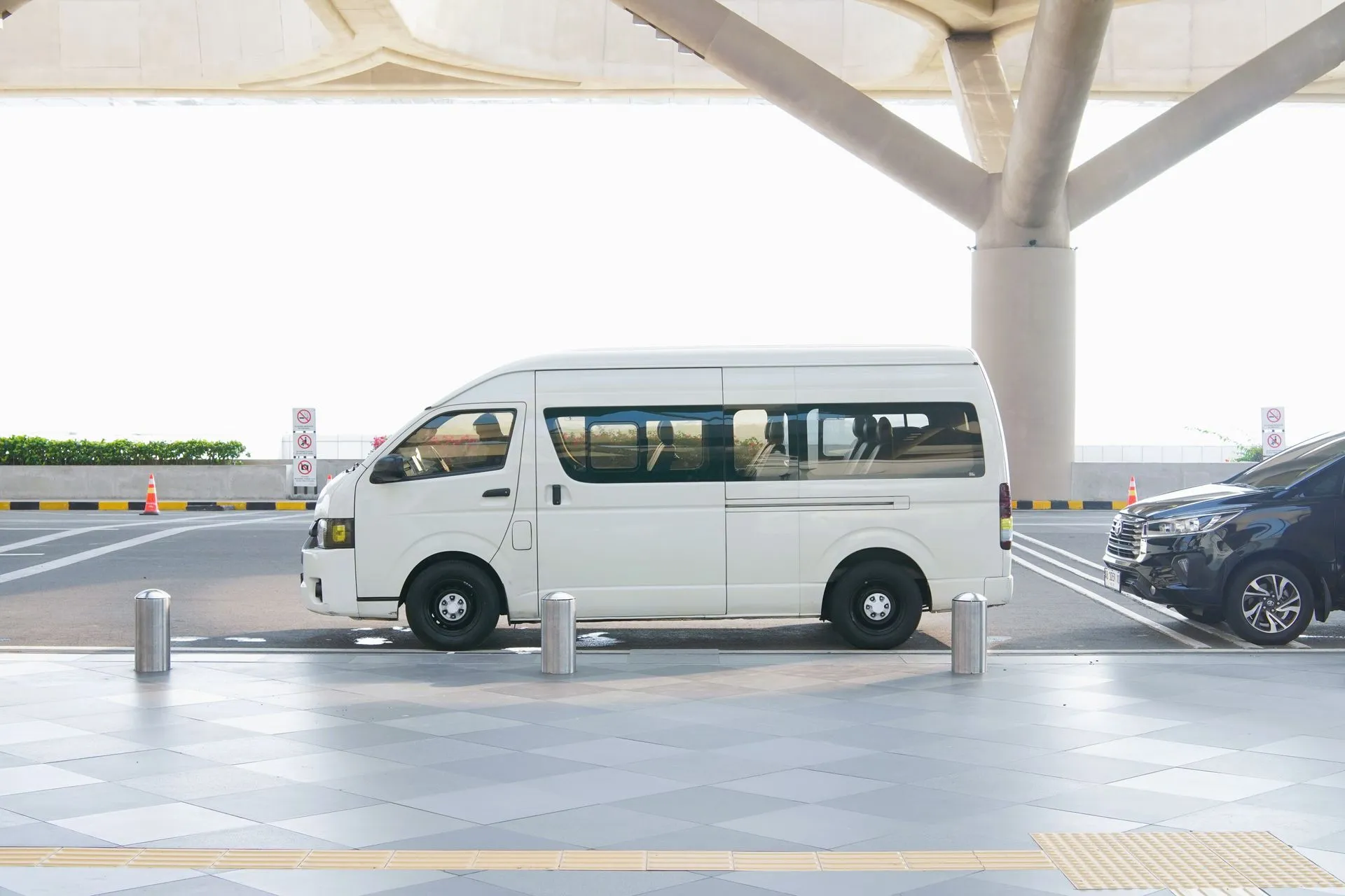 Air-conditioned transfer van on the coastal road between Punta Cana airport and the Bávaro resort strip